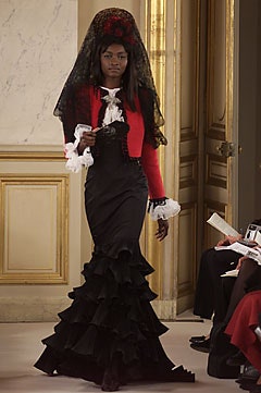 black silk ruffled gown with red jacket