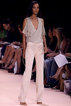 beige silk ruffled top with fitted pants