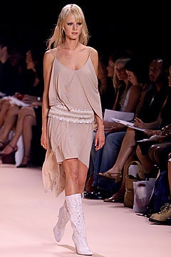 beige draped midi dress with white boots