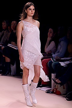 white asymmetric draped dress with embellished boots