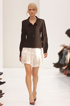 black tailored blazer with white pleated skirt