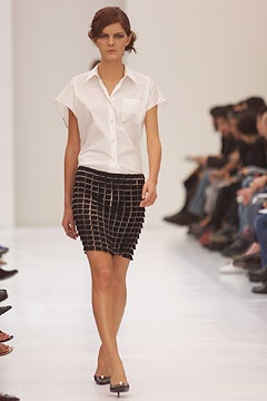 white fitted shirt and black pleated skirt
