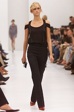 black silk off-shoulder top with fitted pants