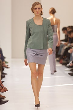 fitted green leather jacket and gray pencil skirt