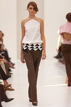 white silk fitted top and brown pants