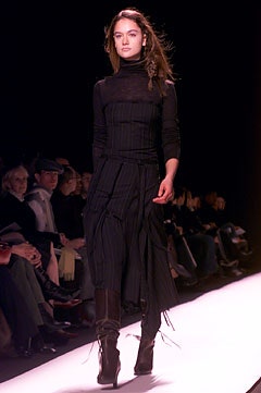 black pleated midi dress and boots