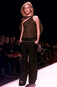 black asymmetric silk top and relaxed pants