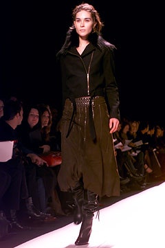 black wool coat with pleated skirt