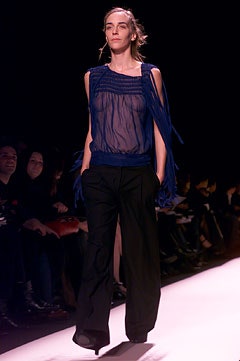 blue sheer top with black pants