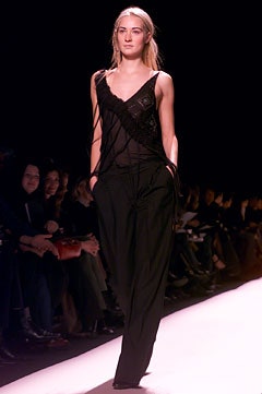 black silk sleeveless top and relaxed pants