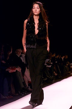 black fur vest and relaxed pants