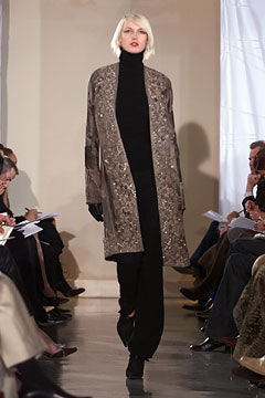 brown embroidered coat with black turtleneck