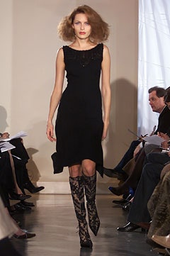 black fitted dress with textured boots