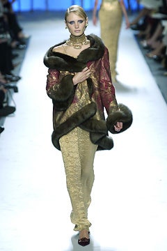 red fur coat with gold pants