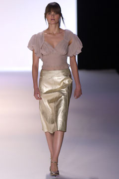 beige silk ruffled blouse and gold midi skirt