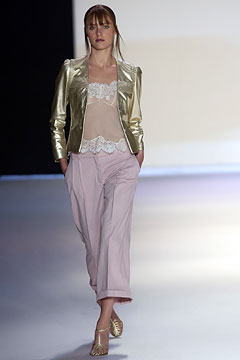 gold fitted jacket with beige top and relaxed pink pants