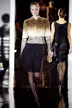 brown embroidered jacket and black dress