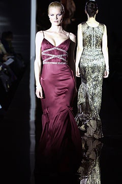 red silk sleeveless v-neck fitted ruched flowing gown