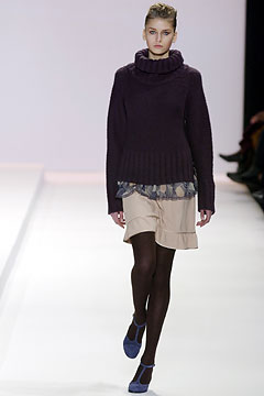 purple wool fitted sweater and beige pleated skirt
