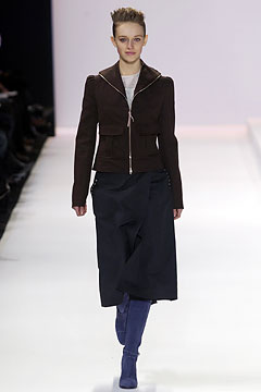 brown fitted jacket and black skirt