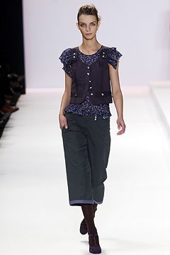 purple vest blue top gray pants