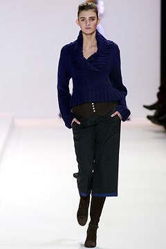 blue fitted sweater with black pants