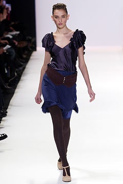 purple silk ruffled top with blue skirt