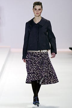 black jacket and purple skirt
