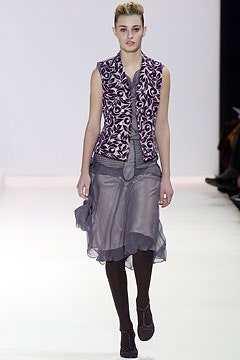 purple embroidered silk vest and gray layered skirt