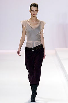 beige silk sleeveless top with purple skirt