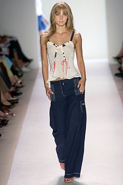 white ruffled top with blue cargo pants