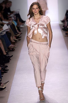 pink silk top with beige pants