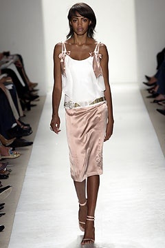 white silk sleeveless top and pink skirt