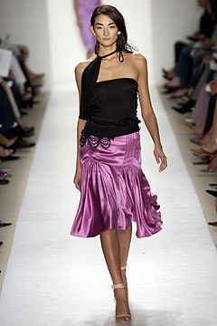 black silk halterneck top and pink midi skirt