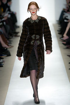brown fur coat with black dress