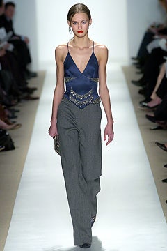 blue silk fitted top with gray pants