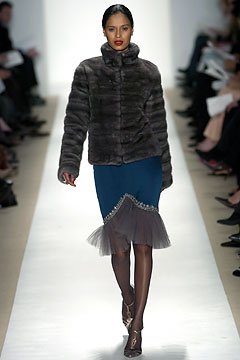 gray faux-fur jacket and blue silk skirt