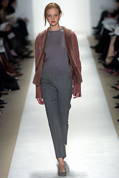 fitted brown faux-fur jacket with gray top and tailored pants