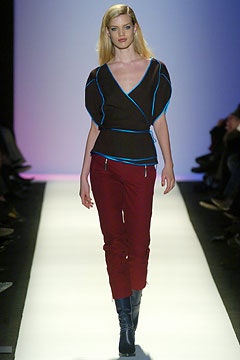 fitted brown top with red pants