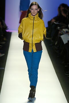 yellow fitted jacket with blue pants