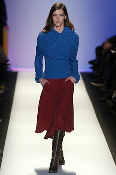 blue knit top with red skirt