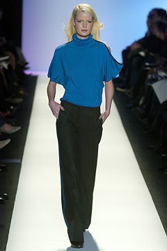 blue relaxed top and black pants