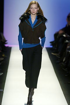 brown and blue fitted jacket with relaxed black pants