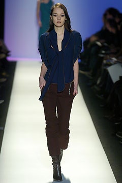 blue silk top with brown pants