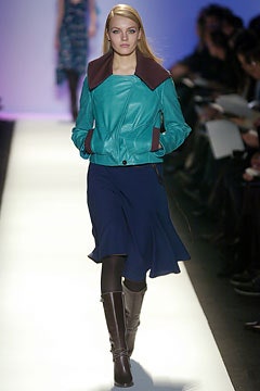teal leather jacket with navy skirt