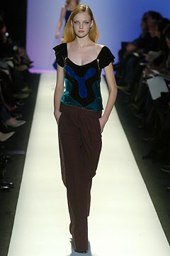 fitted green and blue top with relaxed brown pants