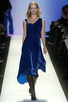 blue velvet midi dress with knee-high boots