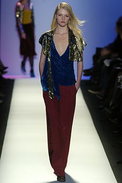 blue sequined top with red pants