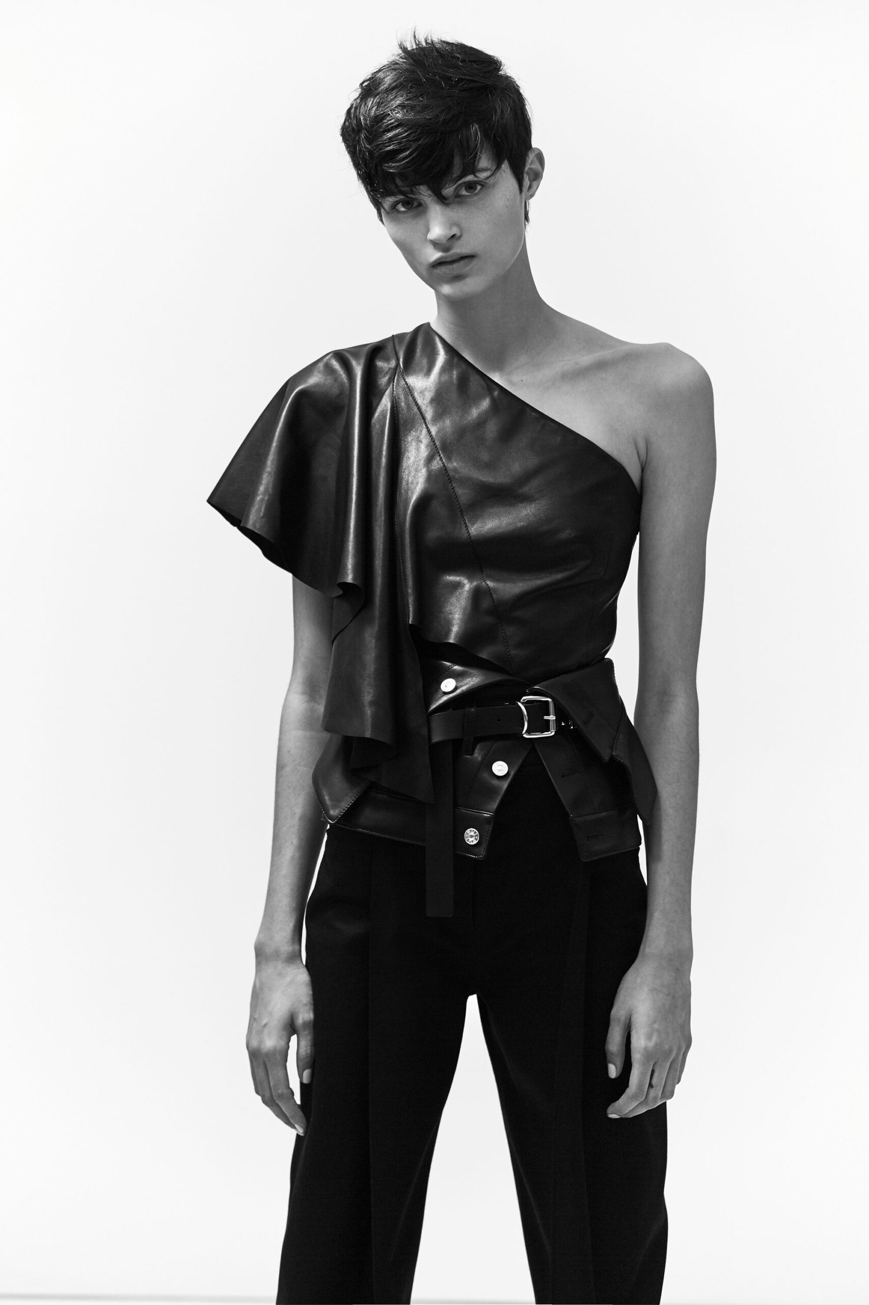 black leather asymmetric top and tailored pants