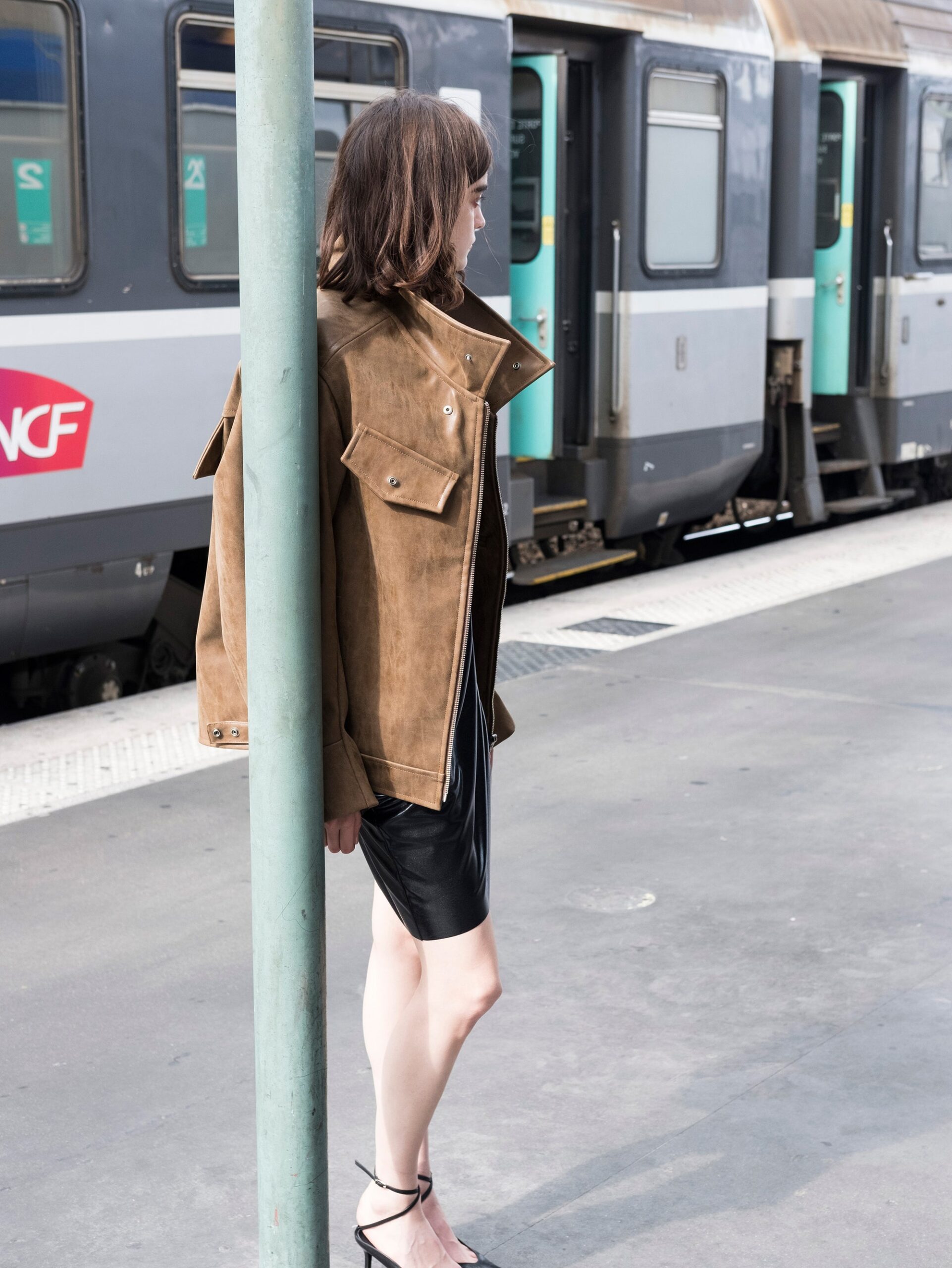 brown suede jacket and black leather dress
